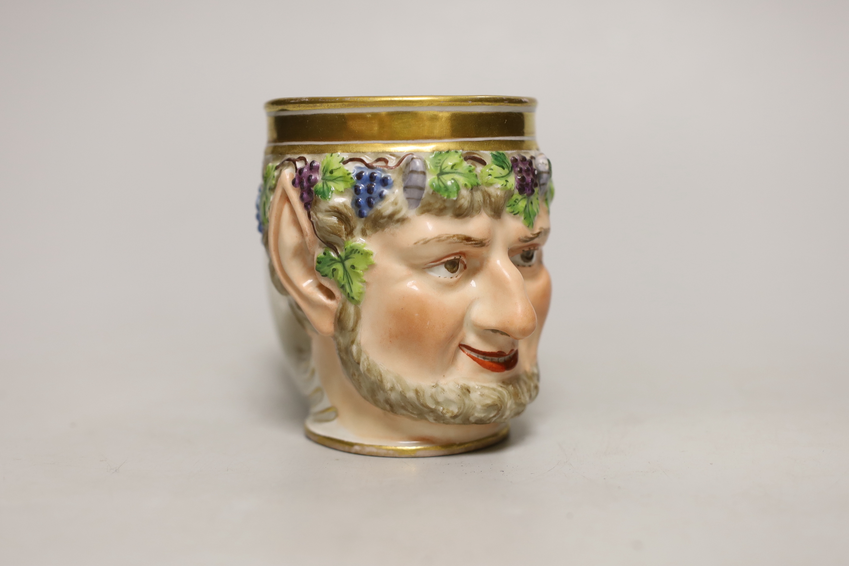 A Vienna porcelain satyr cup, impressed number 827, possibly for the date 1827, 10cm high